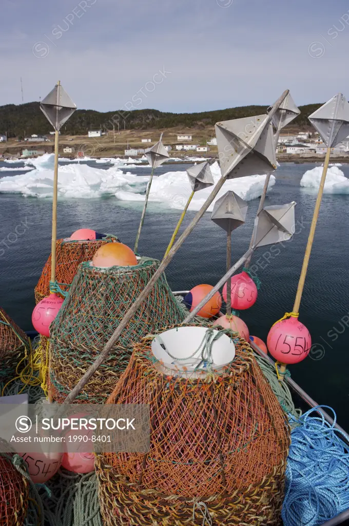Crab pots on the deck of ´Bromley´s Venture´ a crab fishing boat in Conche Harbour unable to leave the dock because of pack ice, Conche, French Shore,...