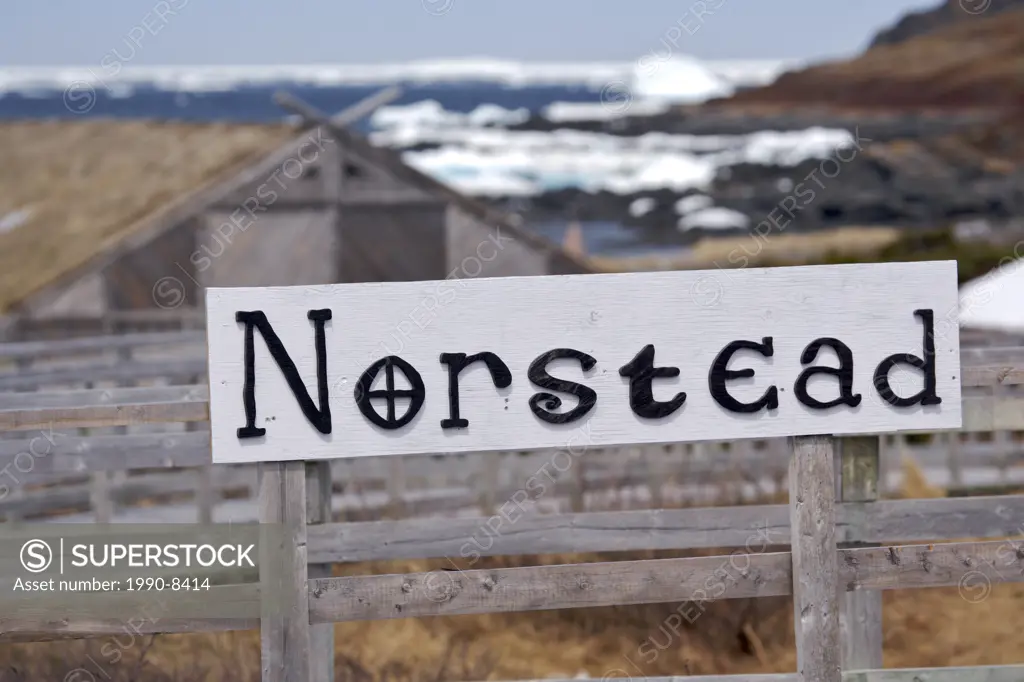 Sign at the entrance to the Norstead Viking Site a Viking Port of Trade backdropped by pack ice in the harbour, Viking Trail, Great Northern Peninsula...