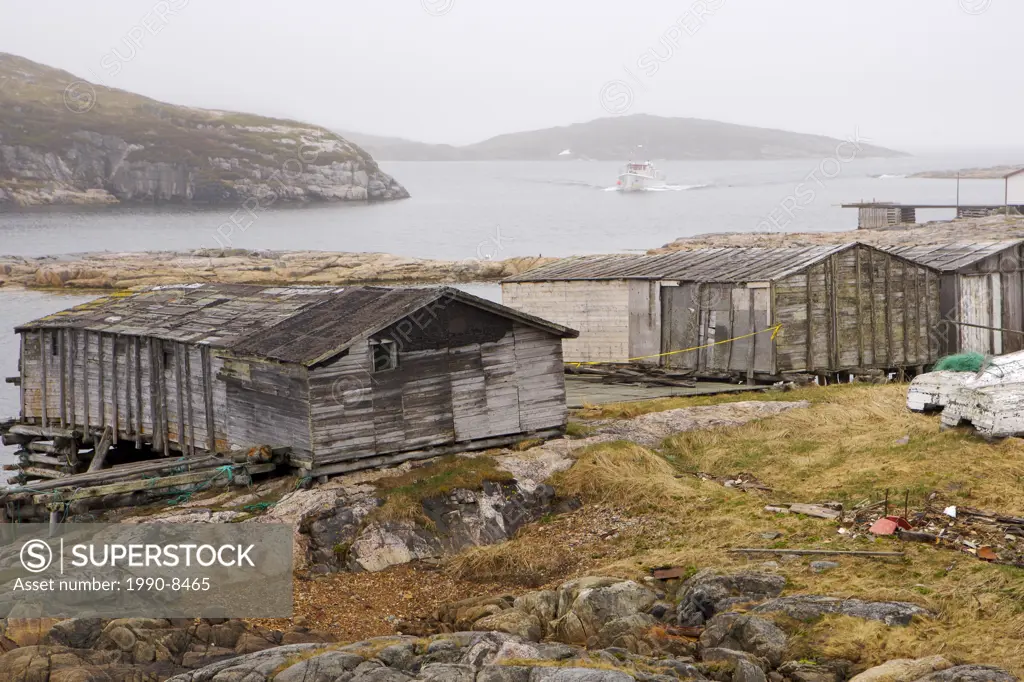 Old fishing stages along the shore at Battle Harbour, Battle Island at the entrance to the St Lewis Inlet, Viking Trail, Southern Labrador, Newfoundla...