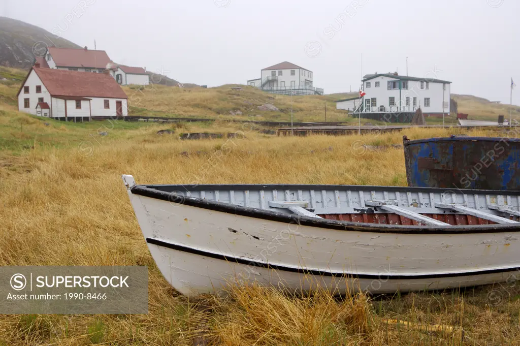 An old fishing boat hauled out on the shore at Battle Harbour, Battle Island at the entrance to the St Lewis Inlet, Viking Trail, Southern Labrador, N...