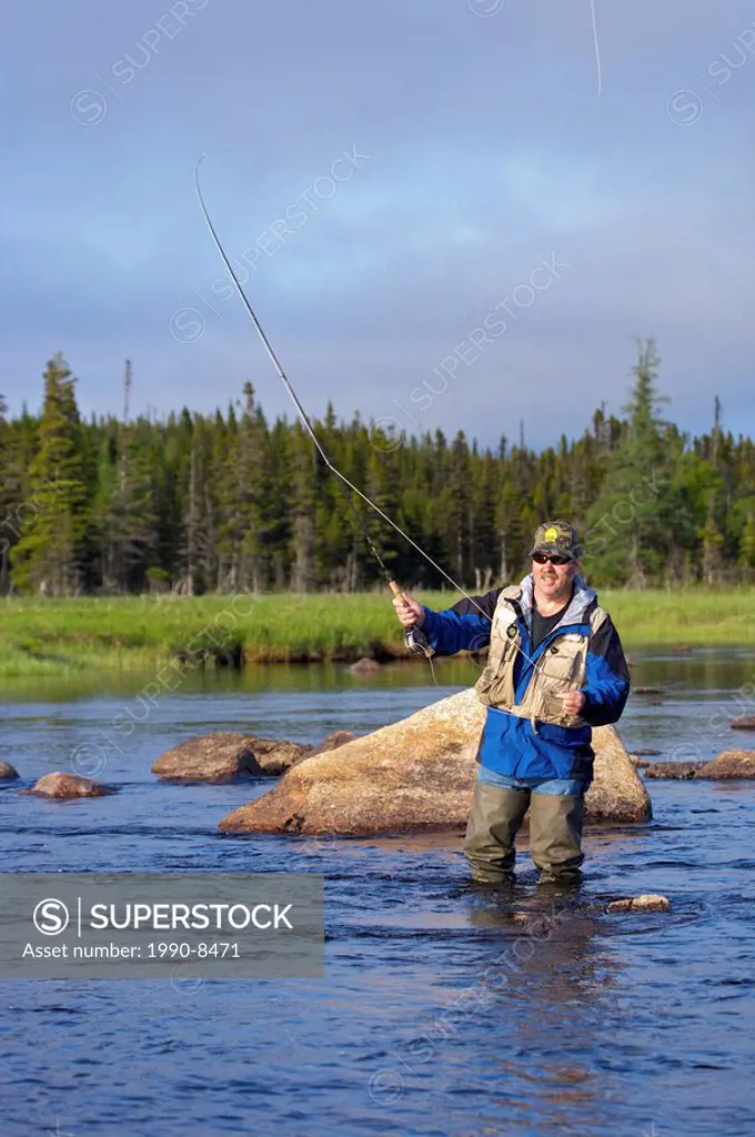 Man fly fishing in Salmon River near the town of Main Brook, Viking Trail, Great Northern Peninsula, Newfoundland & Labrador