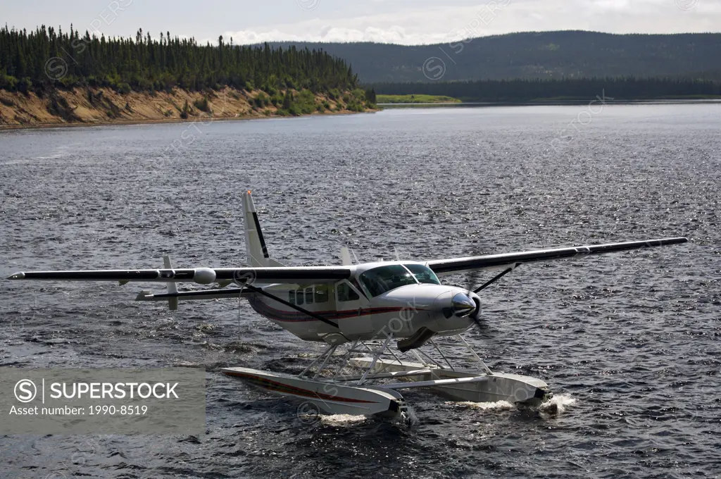 Cessna Caravan amphibian airplane landing on Eagle River at Rifflin´Hitch Lodge in Southern Labrador, Newfoundland & Labrador, Canada