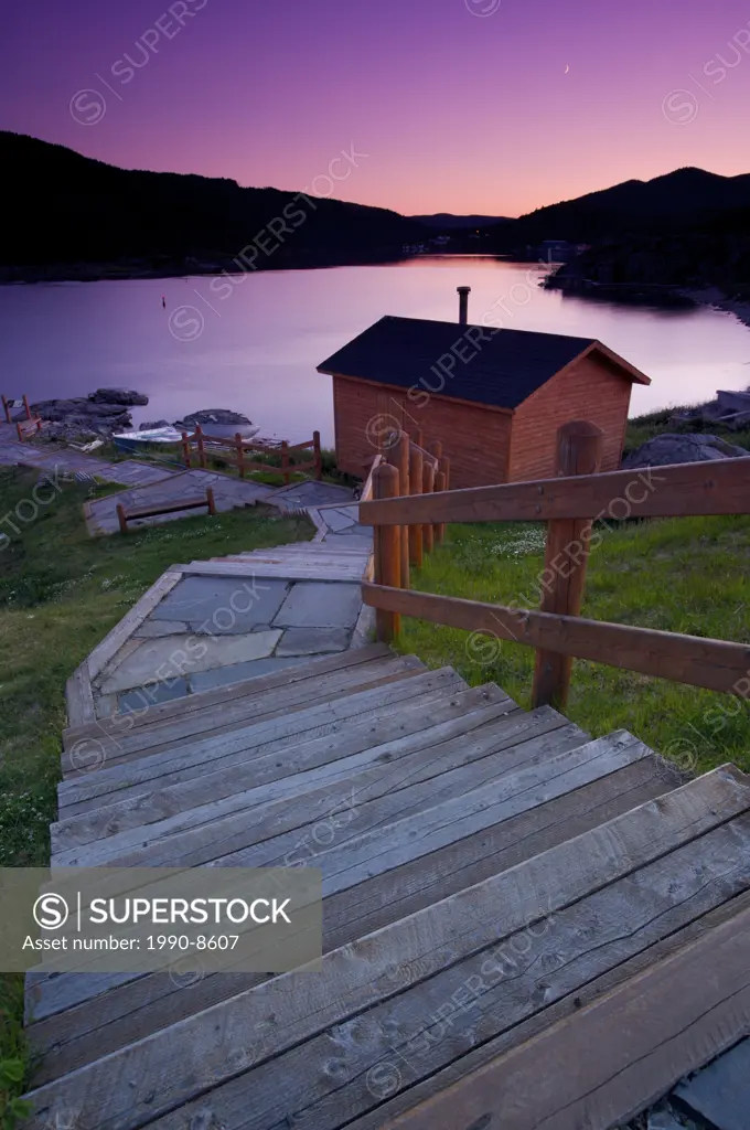 Steps leading down towards a shed at a picnic reserve during sunset in the town of Fleur de Lys, Dorset Trail, Baie Verte Peninsula, Newfoundland & La...