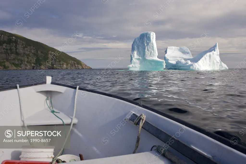 An iceberg stranded in the harbour of Old Bonaventure seen from the bow of a small boat, Bonavista Peninsula, Trinity Bay, Discovery Trail, Newfoundla...