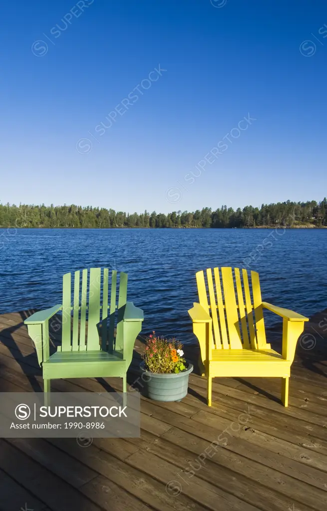 Muskoka chairs on Star Lake, Whiteshell Provincial Park, Manitoba, Canada.