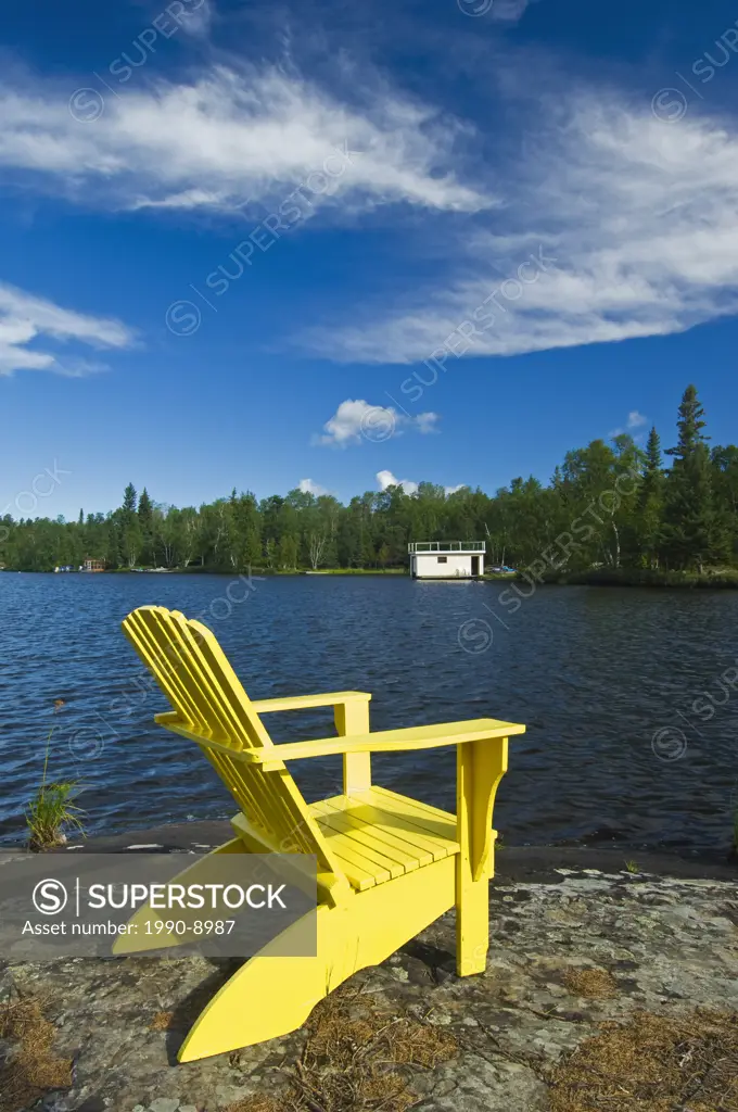 Muskoka chairs on Star Lake, Whiteshell Provincial Park, Manitoba, Canada.