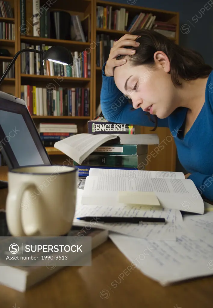 Caucasian female pulling an all nighter, studying for an exam, Alberta, Canada.
