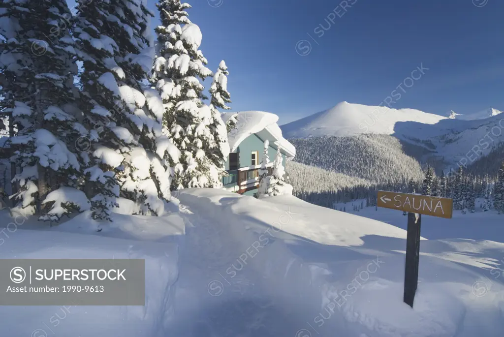 Cabin with Sauna and path through the snow, Chic_Choc Mountains, Quebec, Canada.