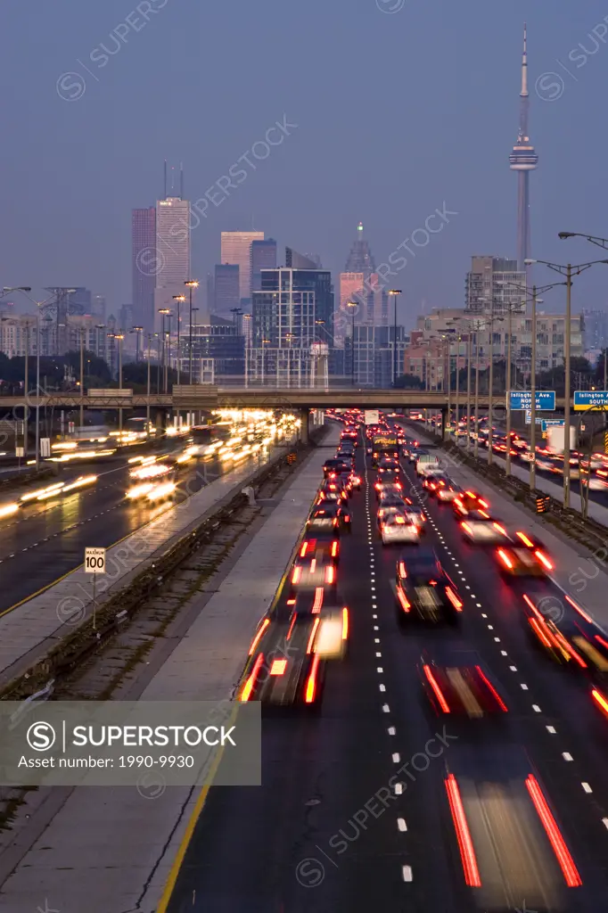 Rush_hour traffic on QEW Queen Elizabeth Way and Toronto city skyline, Toronto, Ontario, Canada.