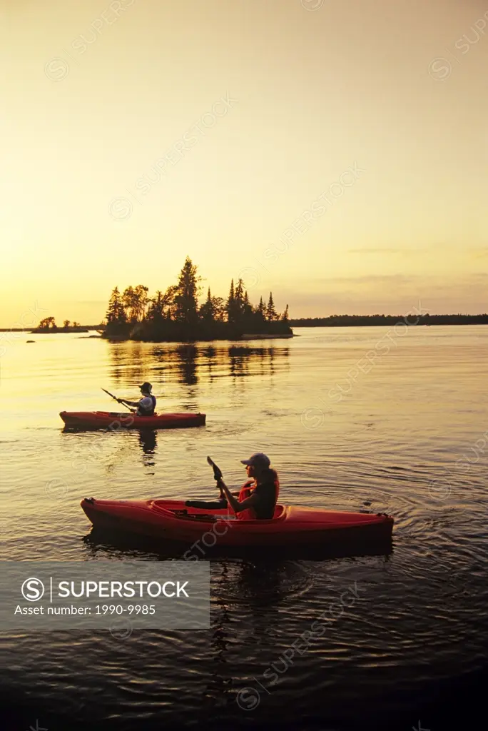 Kayaking on Dorothy Lake, Whiteshell Provincial Park, Manitoba, Canada.