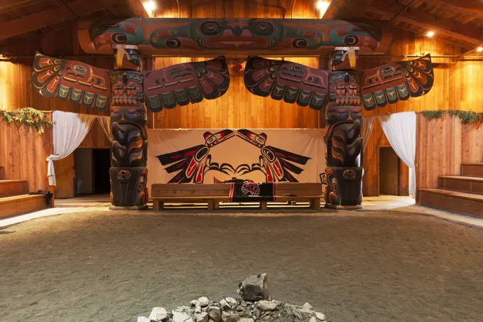 Beautifully carved totem poles and traditional first nations architecture greet visitors to the big house at Klemtu. Klemtu, The Great Bear Rainforest...