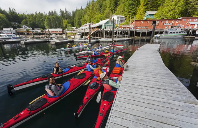 A group of kayakers prepares to paddle around the Johnstone Strait area, leaving from Telegraph Cove.