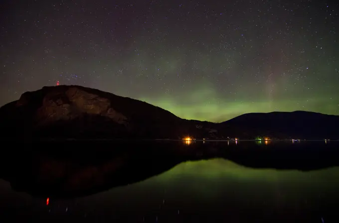 Aurora Borealis hovers over Shuswap Lake and Bastion Mountain near Salmon Arm in the Shuswap region of British Columbia, Canada
