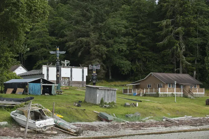 Big House and Totem Poles at Tsatsisnukwomi First Nations Village, also called New Vancouver, Broughton Archipelago, off northern Vancouver Island, Br...