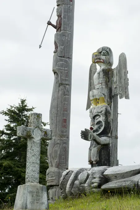 Thunderbird and Dzunukwa by Willie Seaweed, with Christian headstone, Namgis Burial grounds, Alert Bay, Cormorant Island, Vancouver Island, British Co...