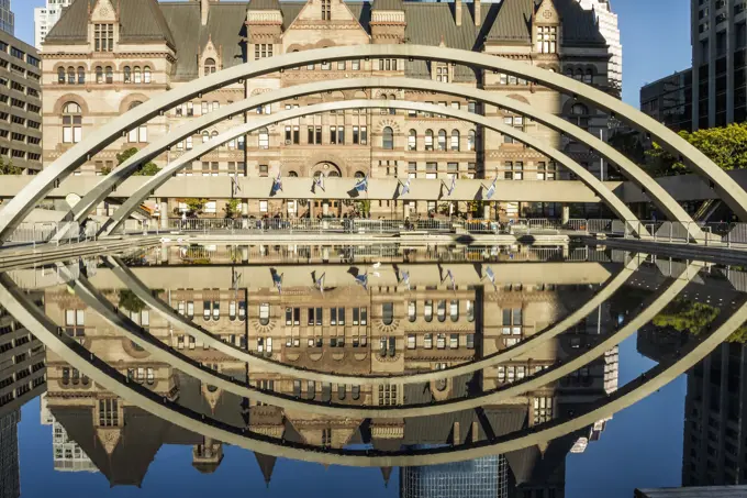 Old City Hall and arches reflected in pool, Nathan Phillips Square, Toronto, Ontario, Canada