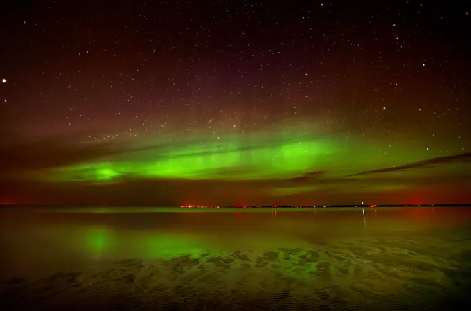 Northern lights or aurora borealis on Lake Winnipeg, Patricia Beach, Manitoba, Canada,