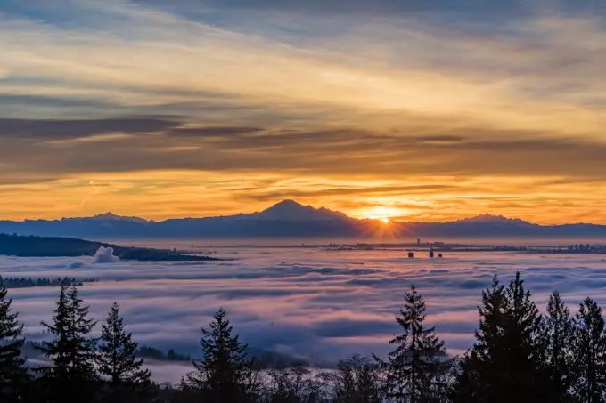 A temperature inversion causes clouds of fog to blanket Vancouver and the Lower Mainland, British Columbia, Canada.