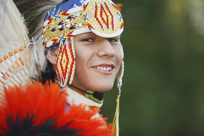 Young First Nations man from the Blackfoot Blood  in a Men´s Fancy Dance outfit, Canada