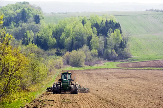 Harrowing potato fields in spring, Florenceville, New Brunswick, Canada, Agriculture