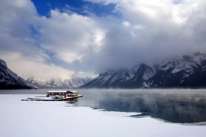 Boathouse in the winter on Lake Minnewanka in Banff National Park in the Canadian Rocky Mountains