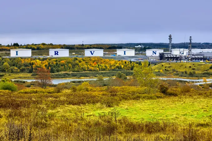 A fall landscape image of the oil storage tanks at the Irving oil refinery in the east end of Saint John New Brunswick Canada