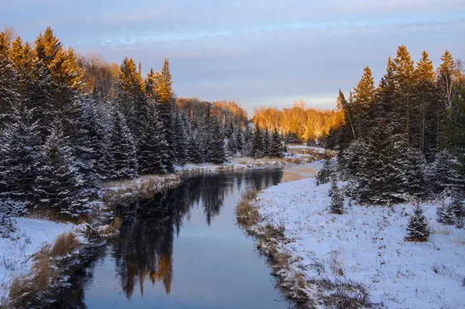 Winter reflections in Junction Creek near sunset, Greater Sudbury, Ontario, Canada
