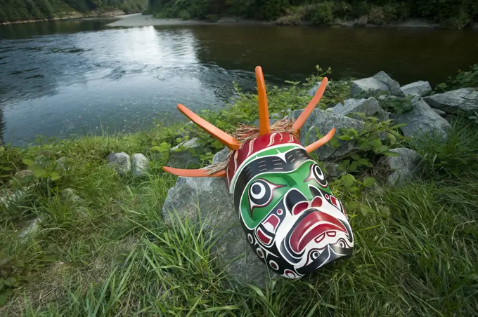 A Native mask on the banks of the Puntledge river in Courtenay, Courtenay, The Comox Valley, Vancouver Island, British Columbia, Canada.