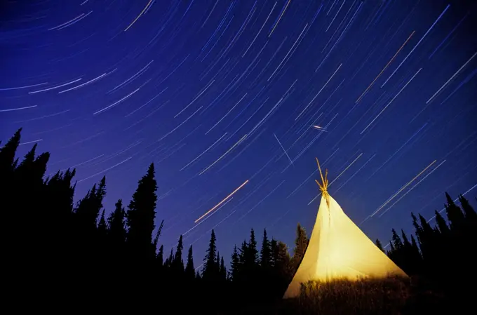 Star trails over a Tipi that was set up by the Canim Lake band in the Cariboo Mountains, British Columbia, Canada.