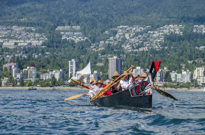 Salish canoes leaves Ambleside Beach, West Vancouver at Many People, One Canoe. Salish First Nations, Gathering of Canoes to Protect the...