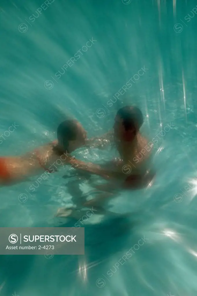 High angle view of a couple swimming in a swimming pool