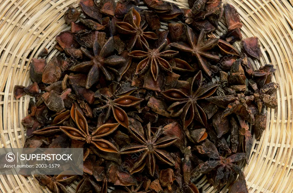 High angle view of Star Anises in a wicker basket (Illicium verum)