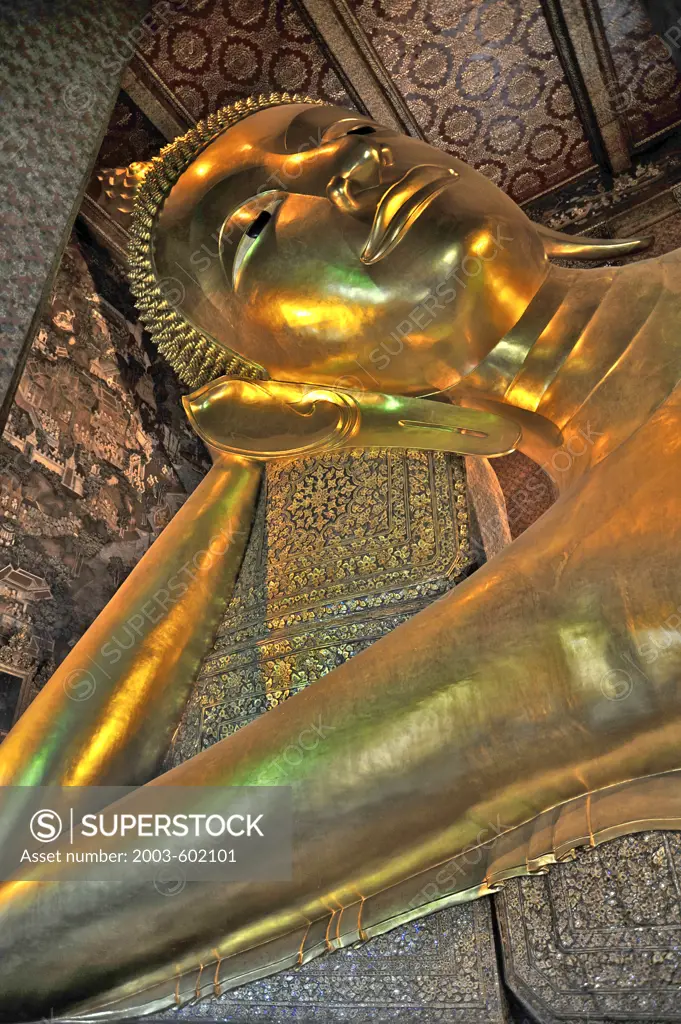 Golden statue of reclining Buddha in a temple, Wat Pho, Phra Nakhon District, Bangkok, Thailand