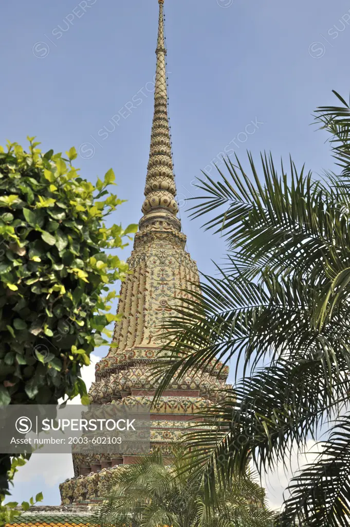 Trees in front of a stupa, Phra Maha Chedi, Wat Pho, Phra Nakhon District, Bangkok, Thailand
