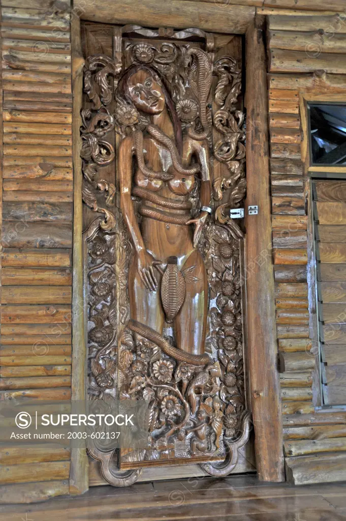 Carving on a door at the temple, Wat Srivichai, Nong Bua Lamphu, Thailand