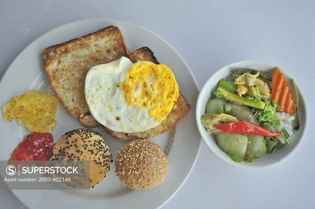 Whole wheat toast and rolls with fried egg and curry
