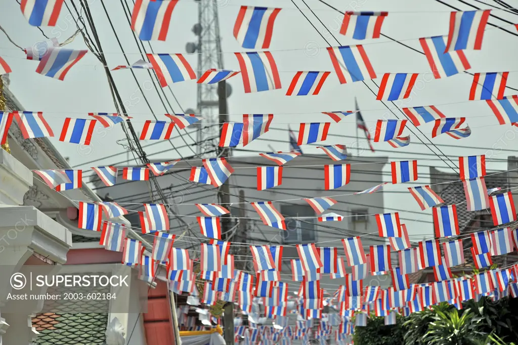 Thai flags hanging at an alley, Wat Arun, Bangkok, Thailand