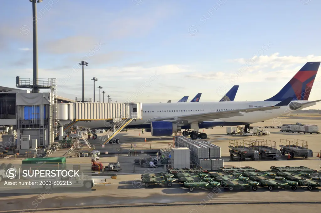 Cargo airplane and cargo containers at an airport, Narita International Airport, Greater Tokyo Area, Chiba Prefecture, Japan