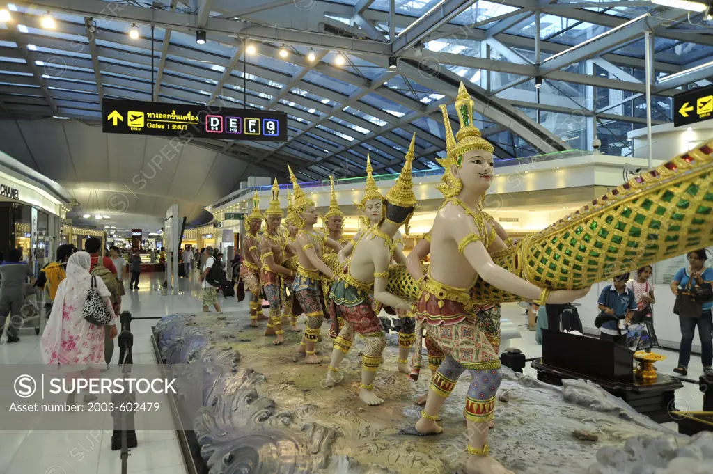 Thailand, Bangkok, Thailand International Airport Suvarnabhumi departure area with traditional hindu sculptures