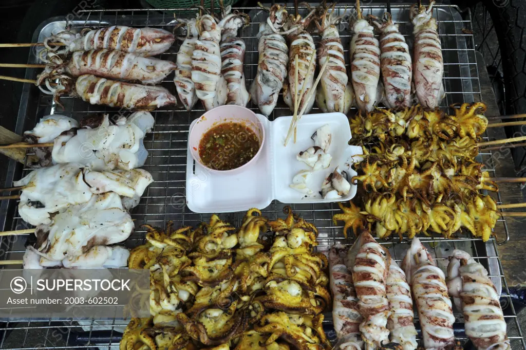 Thailand, Chon Buri, Ban Saen, Nongmun Market, Close up of grilled Squid and baby Octopus