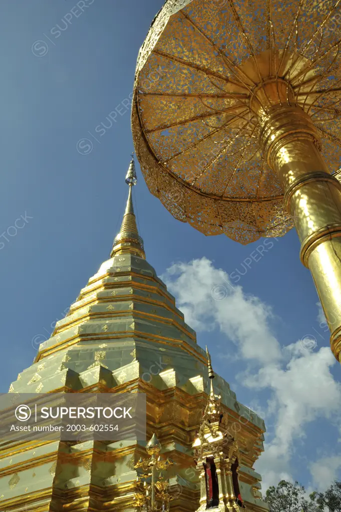 Low angle view of a golden Chedi and umbrella at Wat Phrathat Doi Suthep, Chiang Mai, Thailand