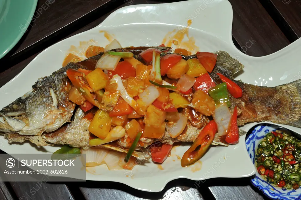 Thailand, Fried Gulf of Thailand fish with sweet/sour pineapple sauce, nam pla fish sauce with chilis and garlic