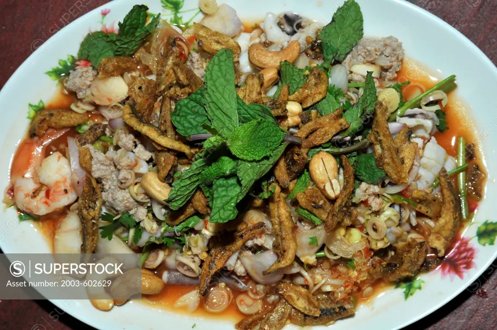 Yum Takkai (Lemon Grass salad) has shrimp, cashews, chicken, mint, squid