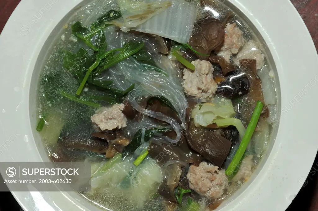Tom Chert Thai vegetable soup with pork balls and mushrooms