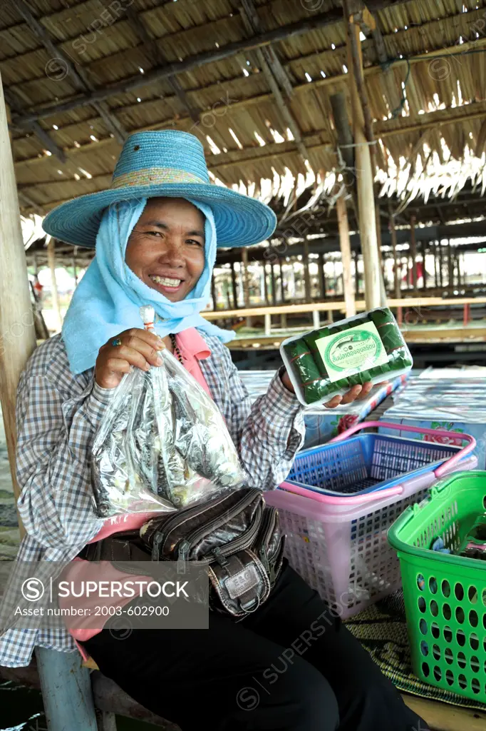 Woman selling fresh fish, Ubolratana Reservoir, Khon Kaen, Thailand