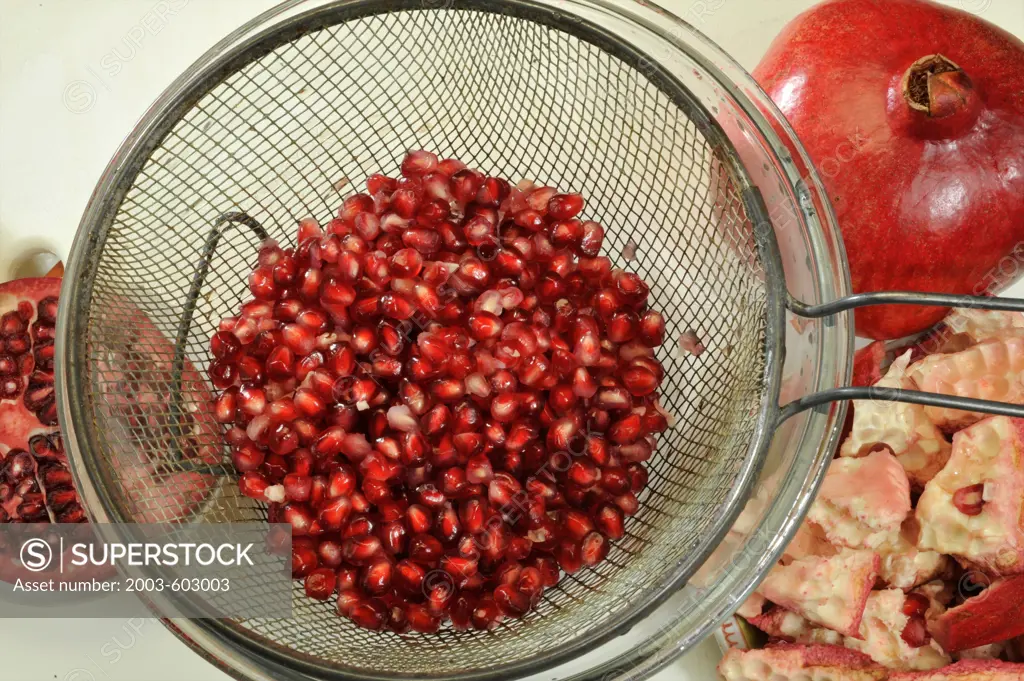 Close up of juicy red pomegranate fruit (Punica granatum)
