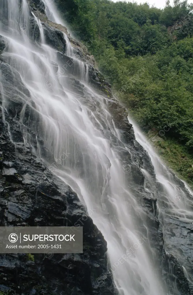 Waterfall in a forest, Horsetail Falls, Chugach National Forest, Chugach Mountains, Alaska, USA
