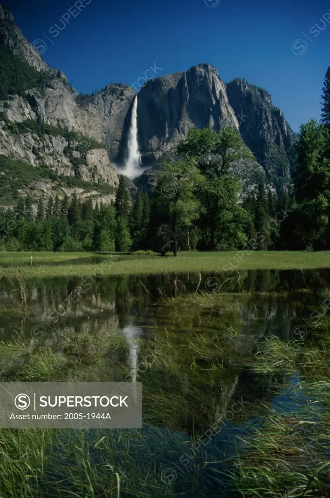 Reflection of a waterfall in a lake, Upper Yosemite Falls, Yosemite National Park, California, USA