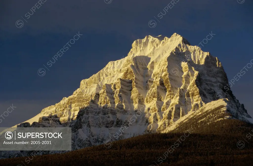 Low angle view of a snow covered mountain, Mount Temple, Banff National Park, Alberta, Canada