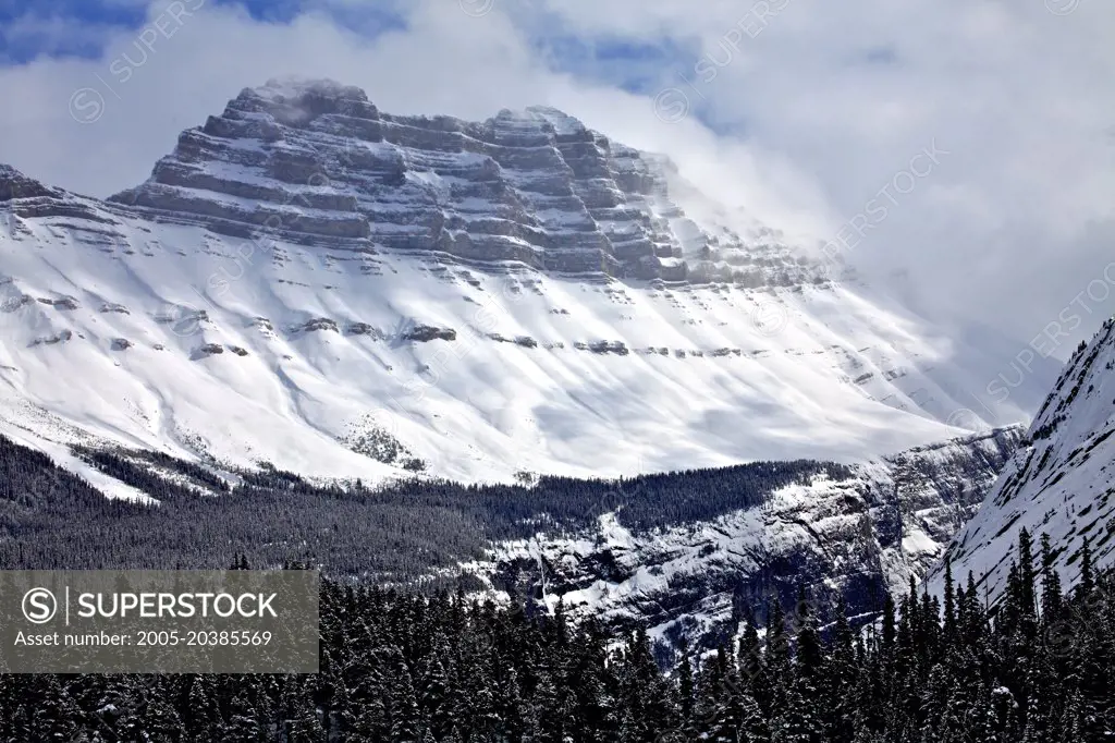 Cirrus Mountain shrouded in Winter Clouds above Icefileds Parkway, Banff National Park, Canada